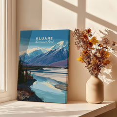Kluane National Park Canada Wall Art Print | Scenic Yukon River Travel Poster displayed by a window with flowers.