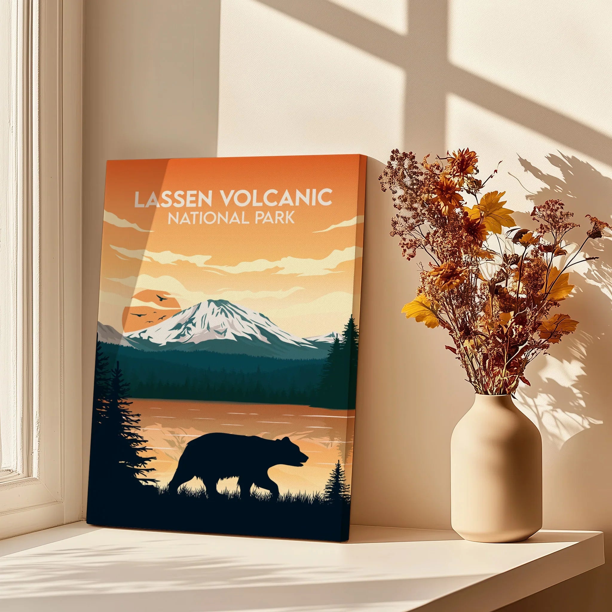 Lassen Volcanic National Park art print with bear silhouette on sunny windowsill, vase of dried flowers nearby.