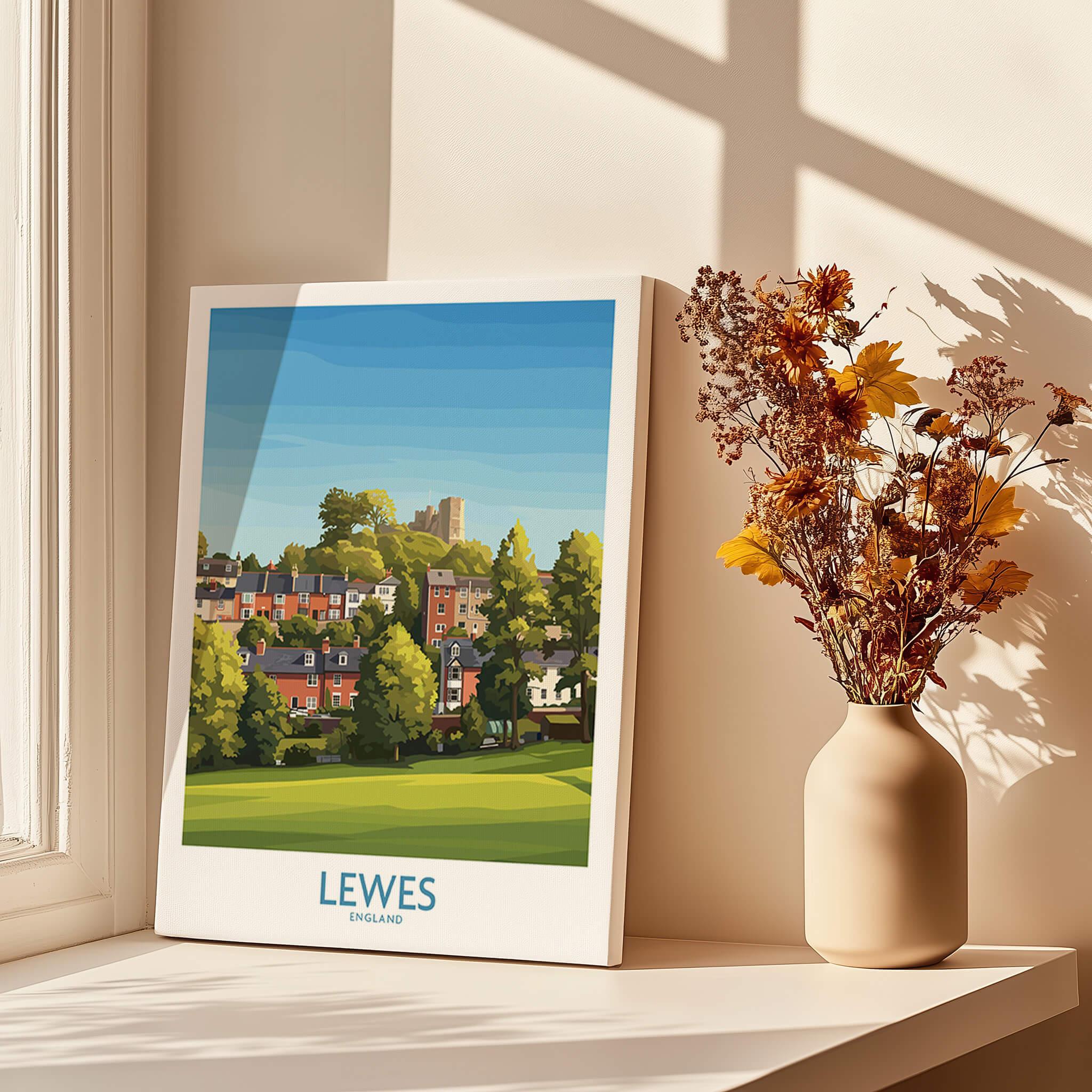 Lewes England travel poster print on windowsill with dried flowers in a vase and sunlight