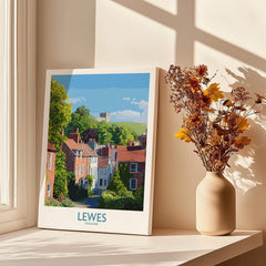 Lewes England travel poster canvas print on windowsill with vase of dried flowers and sunlight