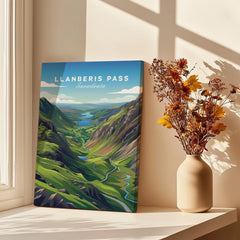 Llanberis Pass Snowdonia travel poster canvas print beside vase with dried flowers in sunlight