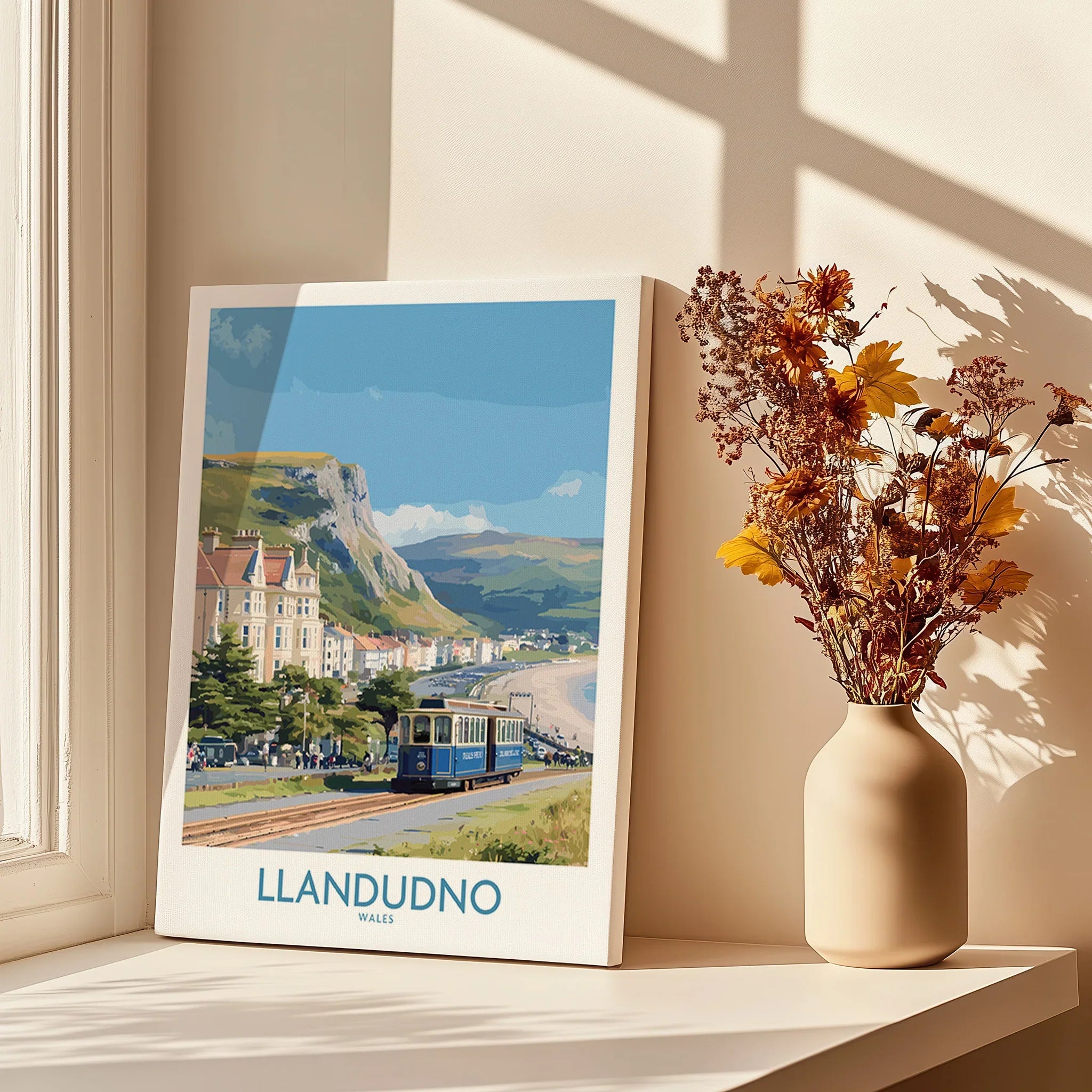 Llandudno Wales art print on windowsill with vase of dried flowers, coastal wall art
