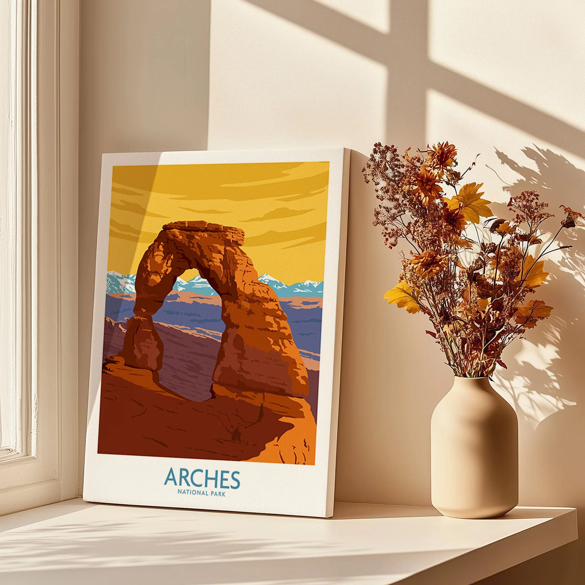 Arches National Park canvas print on windowsill with vase of dried flowers in sunlight