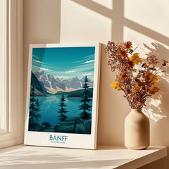 Banff National Park art print on windowsill with sunlight and vase of dried flowers