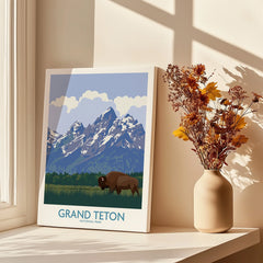 Grand Teton National Park art print with bison, displayed by a vase of dried flowers on a sunny windowsill.
