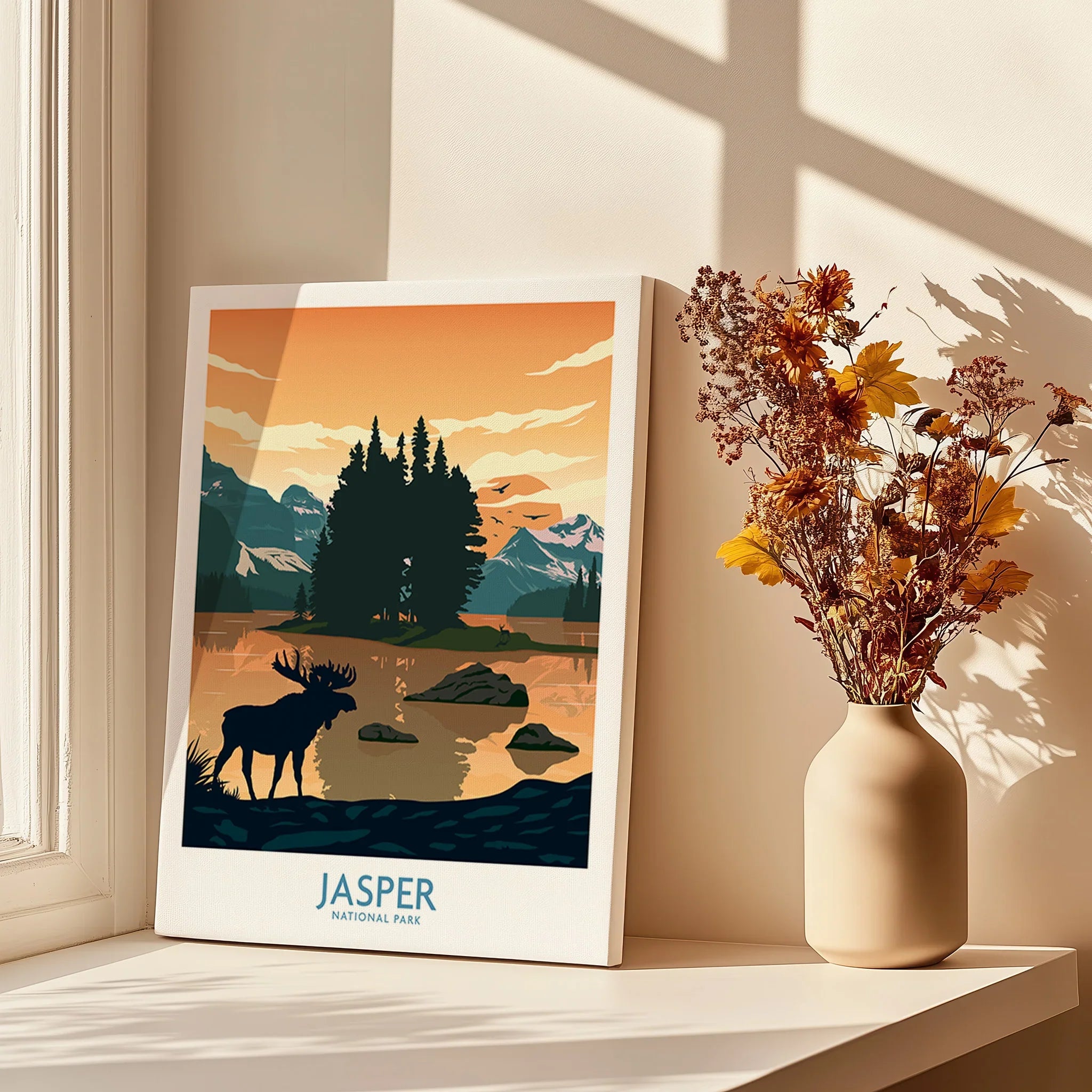 Jasper National Park wall art print on windowsill with vase of dried flowers, sunlight, landscape illustration