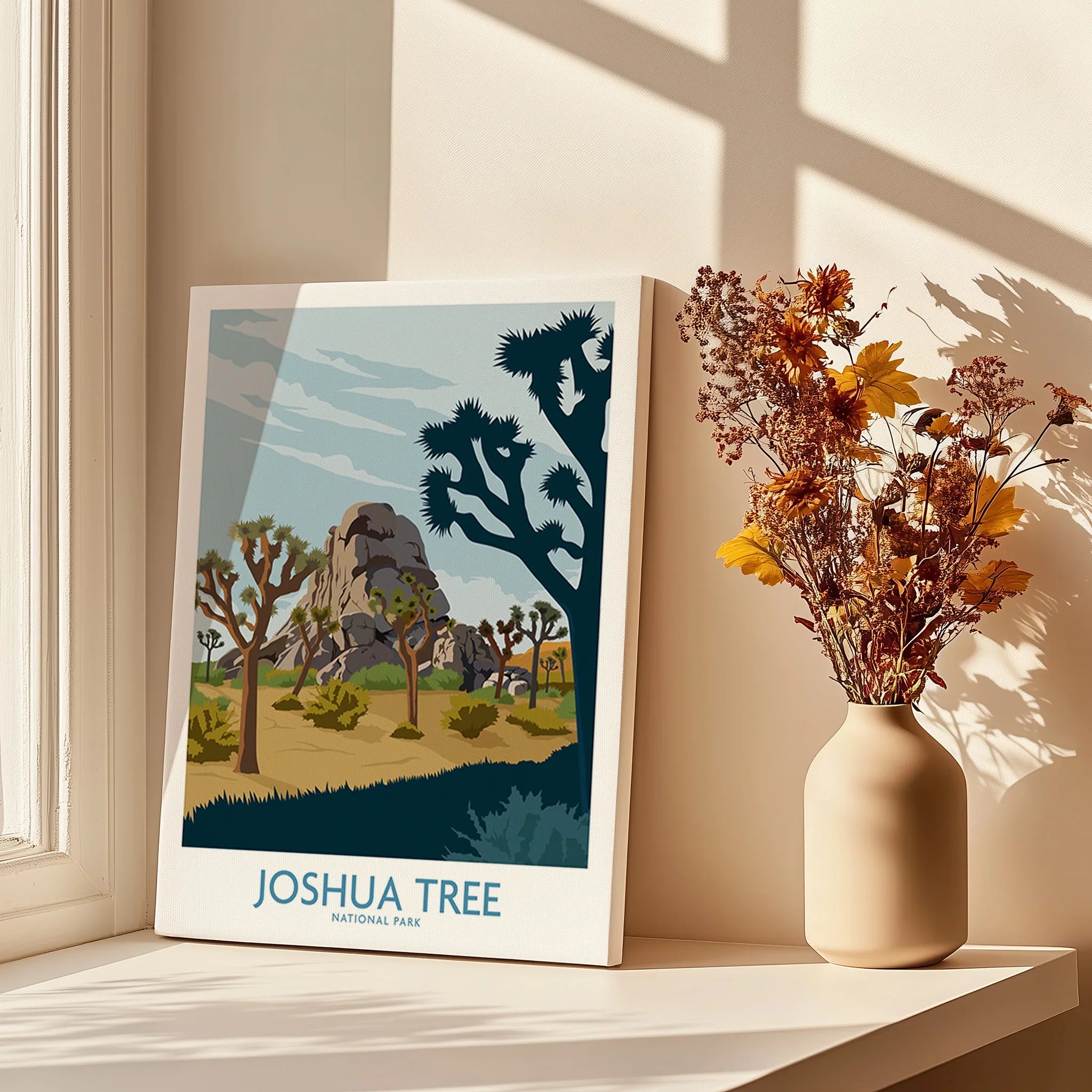 Joshua Tree National Park art print on windowsill with vase of dried flowers in sunlight