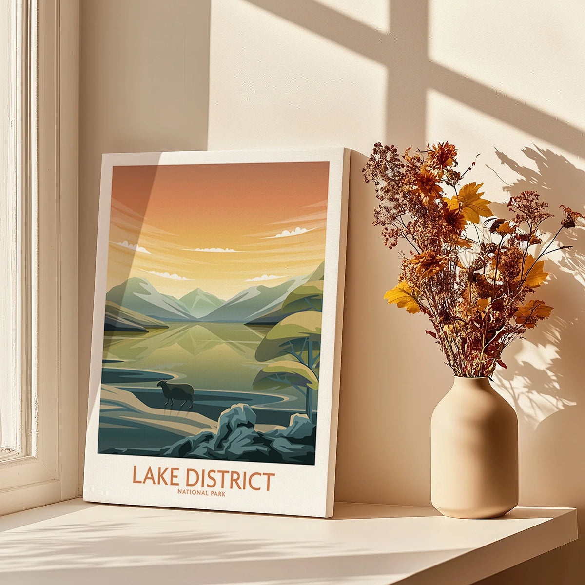 Lake District National Park travel poster print by window with shadows and dried flowers in vase