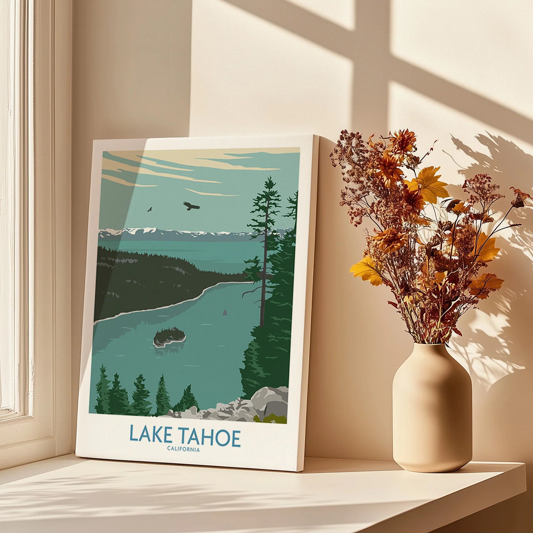 Lake Tahoe travel poster canvas print on windowsill with vase of dried flowers in sunlight