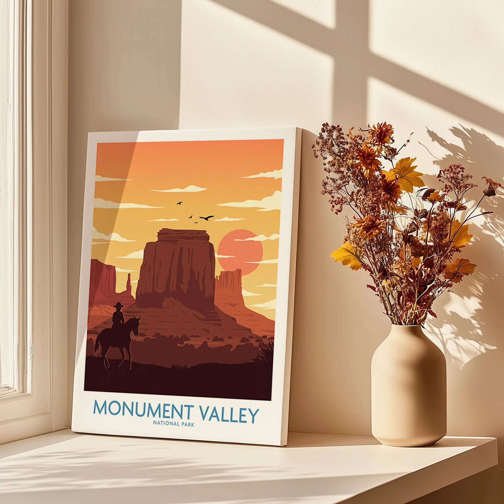 Monument Valley poster art with cowboy on horse, sunset tones, vase of dried flowers nearby
