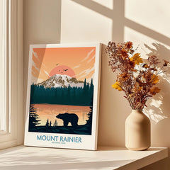 Mount Rainier National Park canvas print with bear illustration beside a vase of dried flowers on a sunlit windowsill.