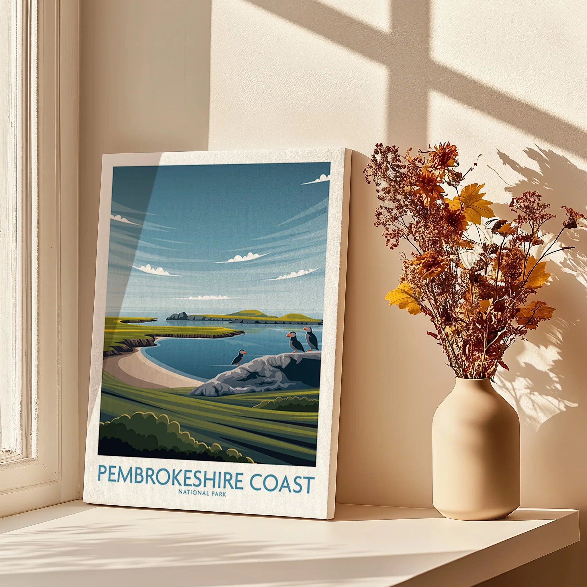 Pembrokeshire Coast National Park canvas print on windowsill with vase of dried flowers