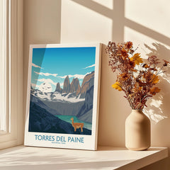 Torres del Paine National Park art print on windowsill with vase of dried flowers in sunlight