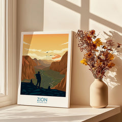 Zion National Park canvas print in sunlight next to a vase of dried flowers on a windowsill.