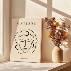 Matisse Art Prints - Abstract Line Face Drawing showcasing a minimalist line drawing of a woman's face with a beige background.