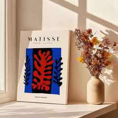 Matisse Art Prints -  Red Coral Black Leaves Blue Frame Poster displayed with beautiful sunlight and flowers.