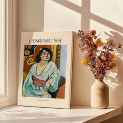 Matisse Poster - Algerian Woman 1909 Fauvist Wall Art Print displayed beside dried flowers.