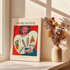 Matisse Poster - La Blouse Roumaine 1940 Famous Art Print displayed on a windowsill with dried flowers.