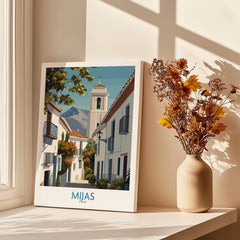Mijas Spain Canvas Print | Historic Spanish Village Scene Poster displayed on a windowsill with dried flowers.