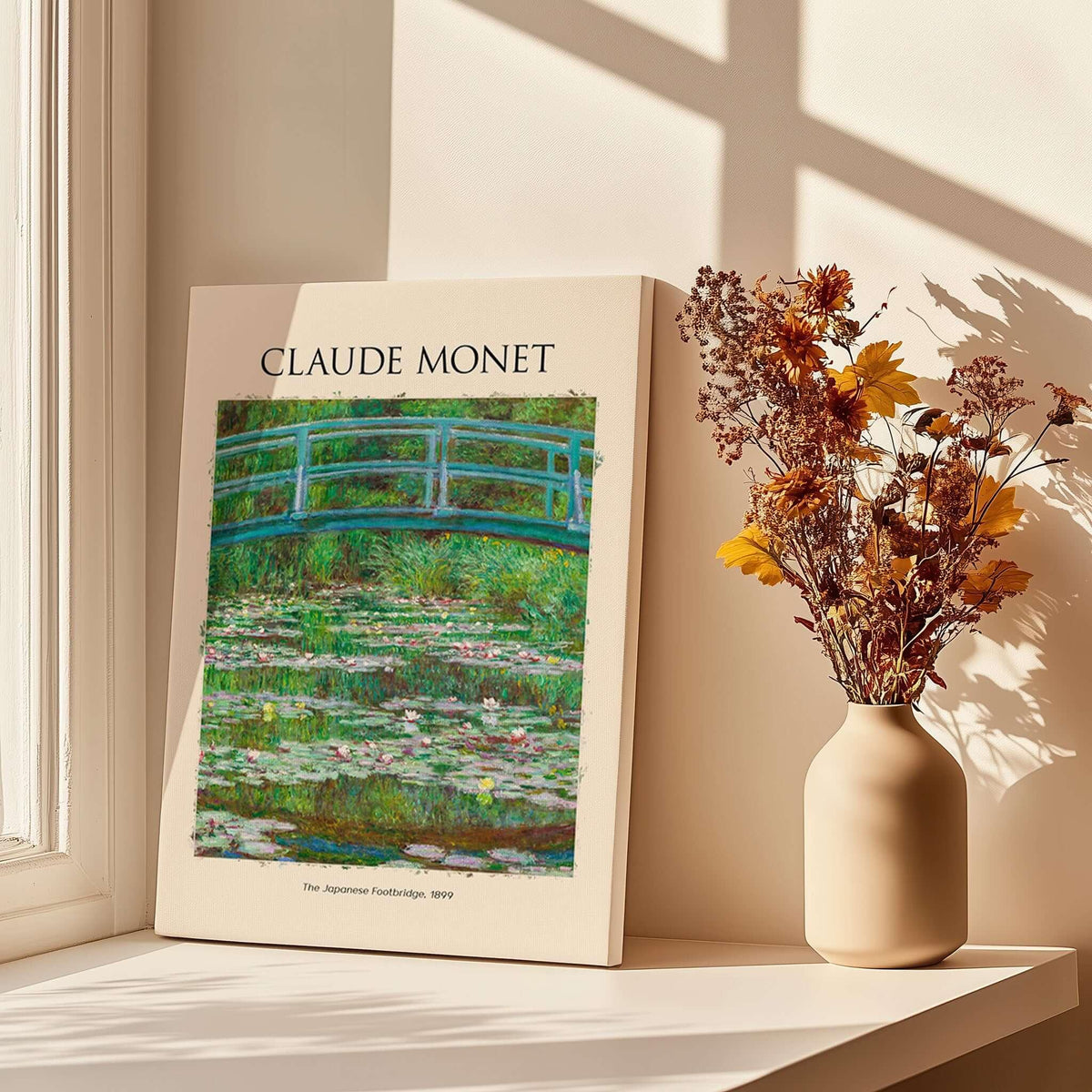 Monet Japanese Footbridge Water Lilies Giverny Garden Poster Art Print displayed near a vase and flowers.