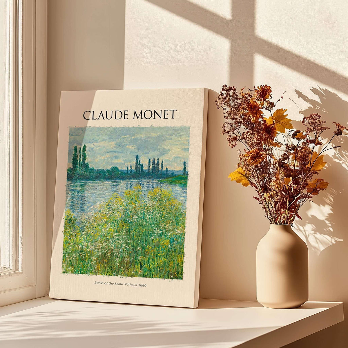 Monet Banks of the Seine Vétheuil River Landscape Art Print Poster displayed with flowers in a vase.
