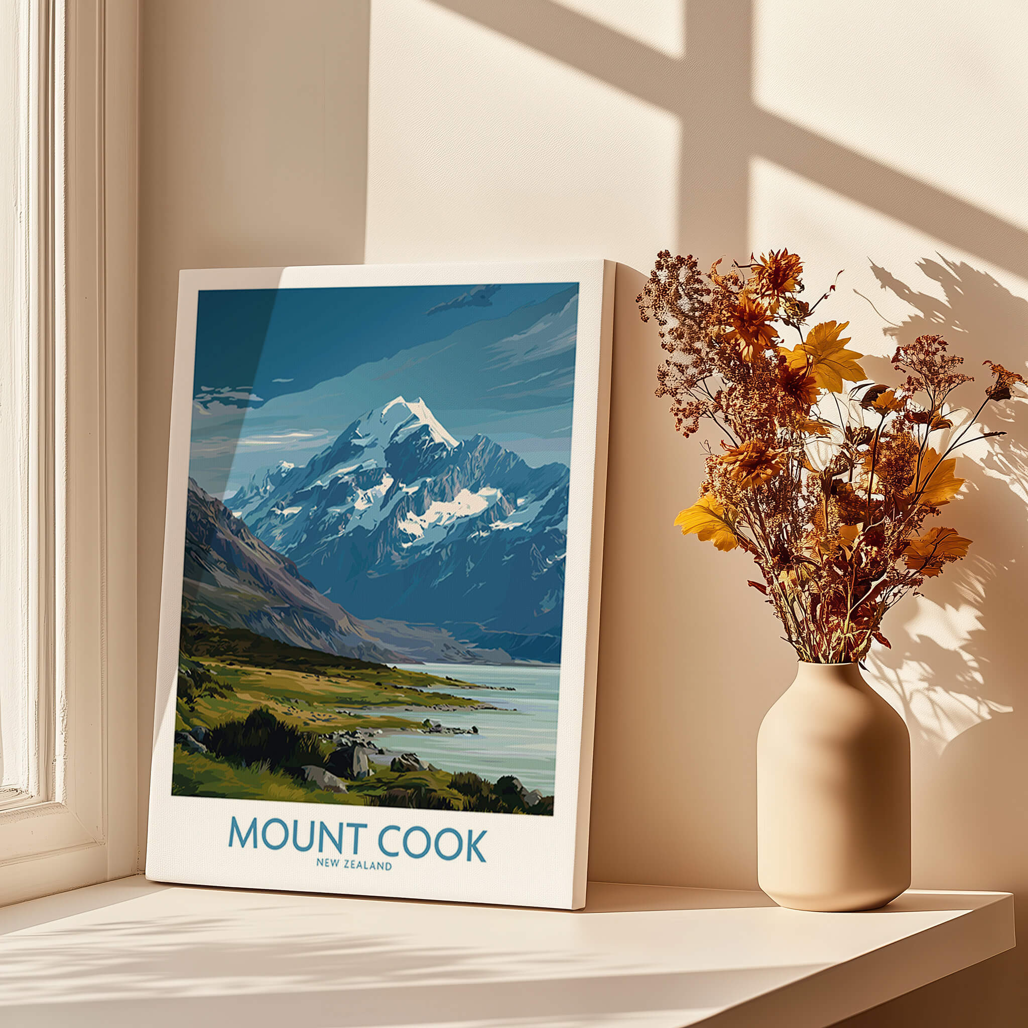 Mount Cook New Zealand Poster | Southern Alps Mountain Canvas Print displayed beside flowers in a vase by a sunny window.