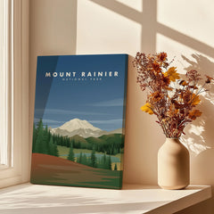 Mount Rainier National Park poster with mountain landscape, next to vase of dried flowers in window light