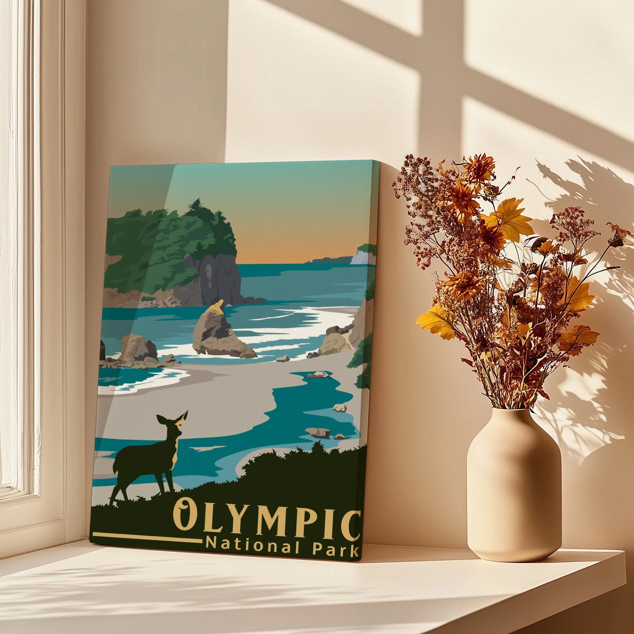 Olympic National Park poster with coastal landscape beside dried flowers on a sunlit windowsill