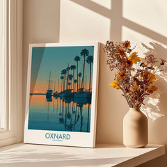 Oxnard California Poster | Scenic Pacific Marina Canvas Print displayed beside a vase of flowers on a windowsill.