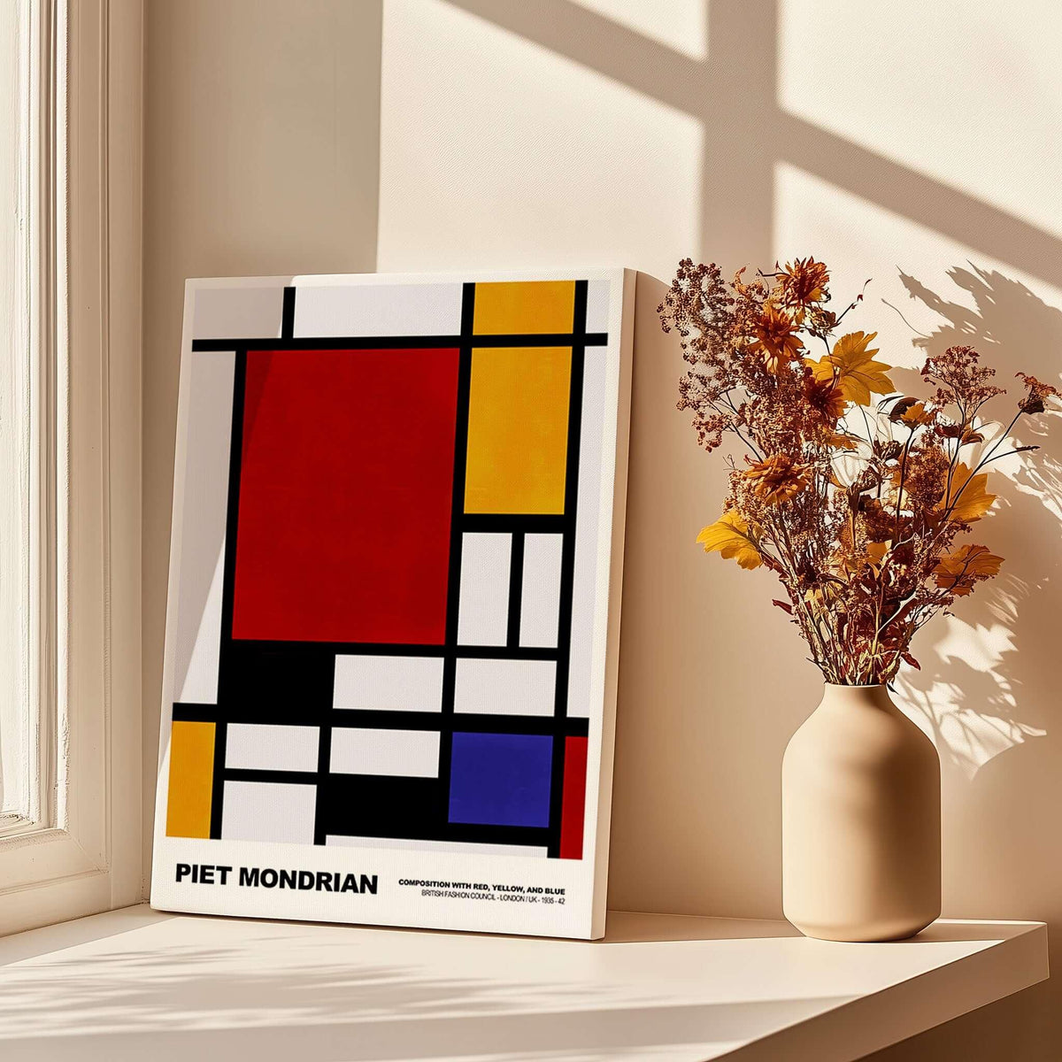 Piet Mondrian Composition Red Yellow Blue 1939 De Stijl Poster Geometric Abstract Print displayed on a table with flowers.