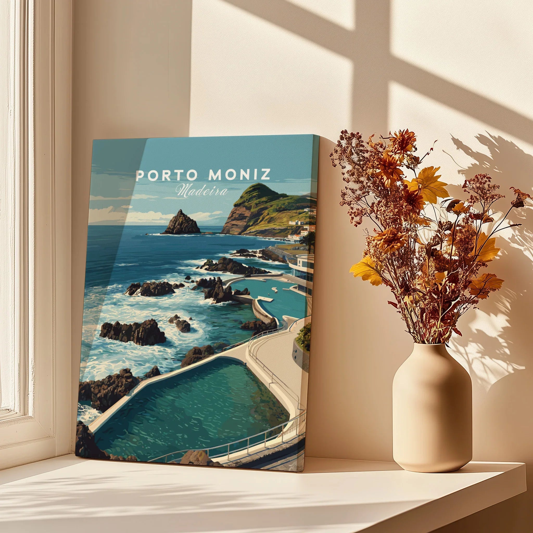 Porto Moniz Madeira travel poster canvas on windowsill with vase of dried flowers, sunlight and shadows.