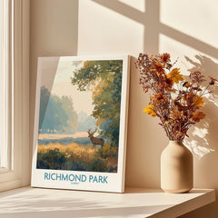 Richmond Park travel poster print on shelf by window with shadows and dried flowers