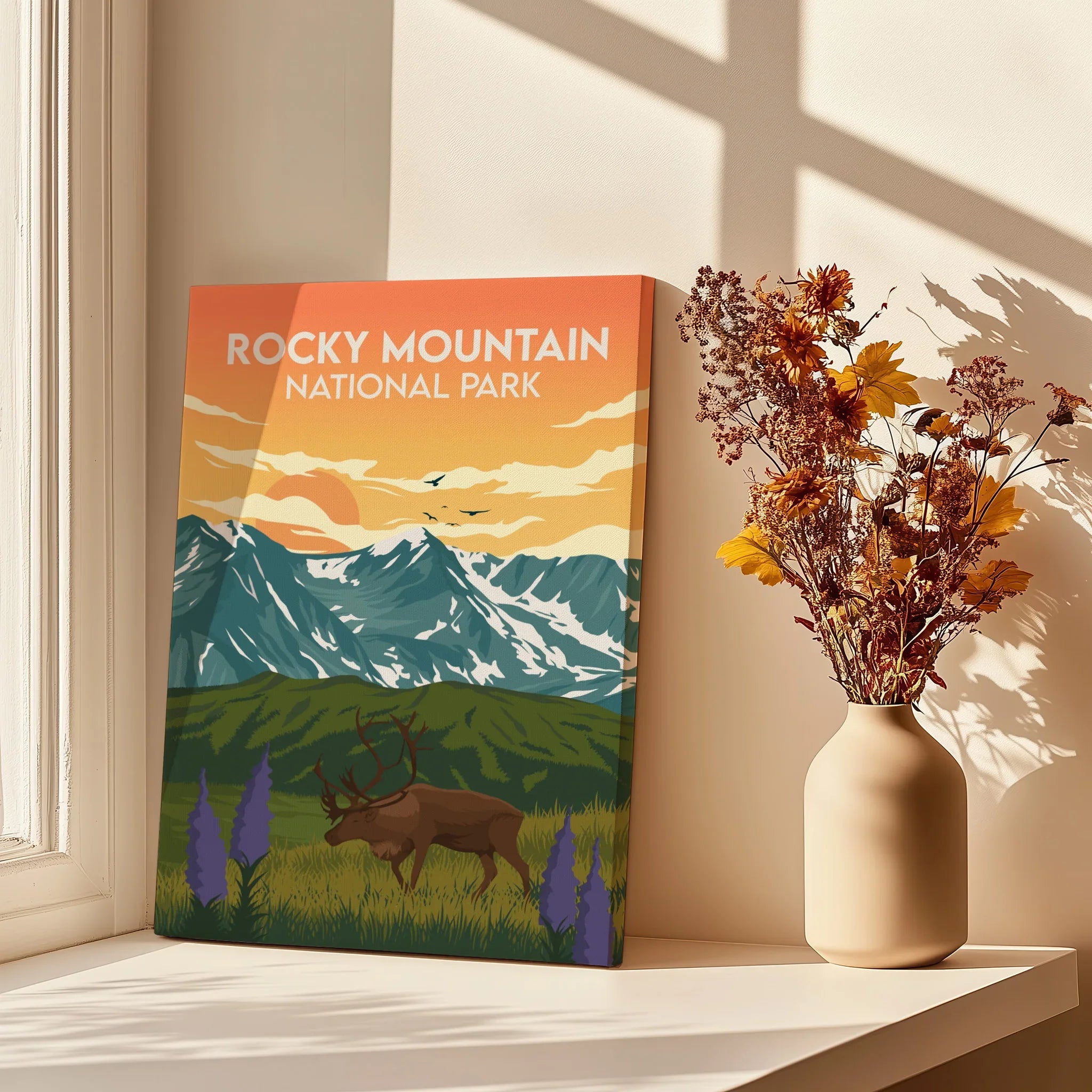 Rocky Mountain National Park art print on windowsill with vase of autumn flowers, mountain decor