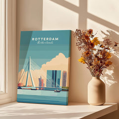 Rotterdam Netherlands skyline travel poster on windowsill with vase of dried flowers