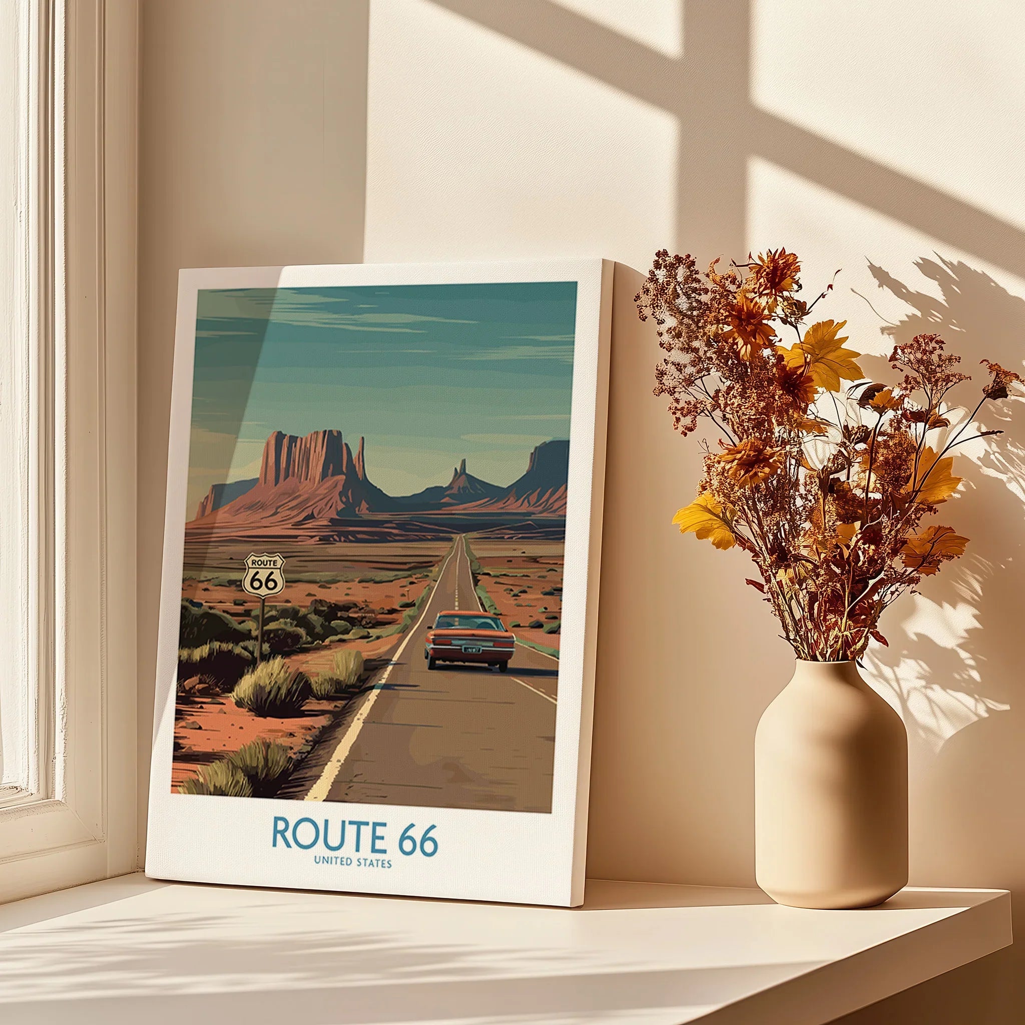 Route 66 travel poster on windowsill with shadows and vase of dried flowers