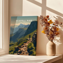 Scafell Pike Lake District Travel Poster | Mountain Valley View Wall Art Print displayed in a bright room with flowers.