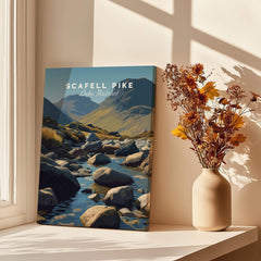 Scafell Pike Poster Lake District Wall Art Print displayed on a table with flowers and sunlight.