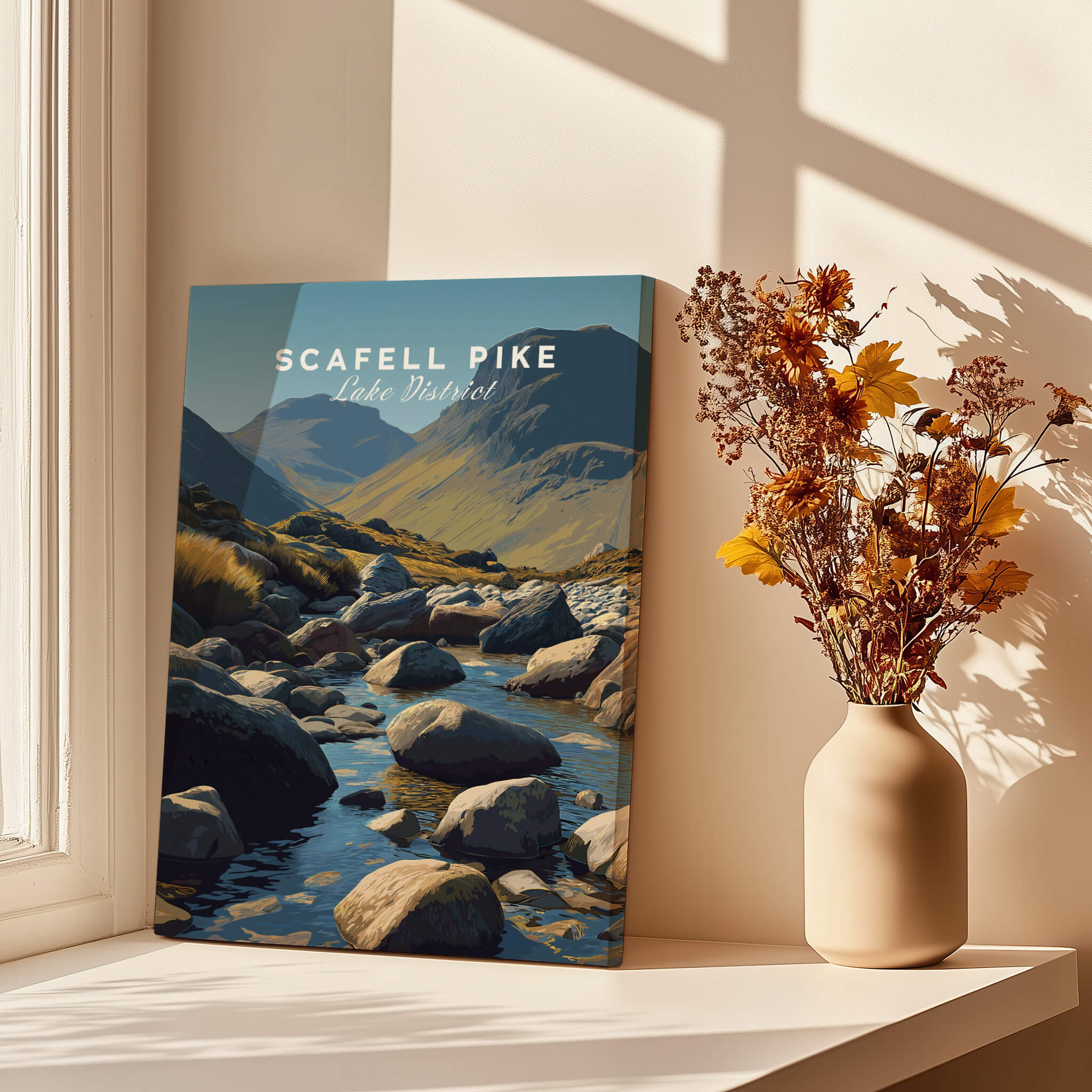 Scafell Pike Poster Lake District Wall Art Print displayed on a table with flowers and sunlight.