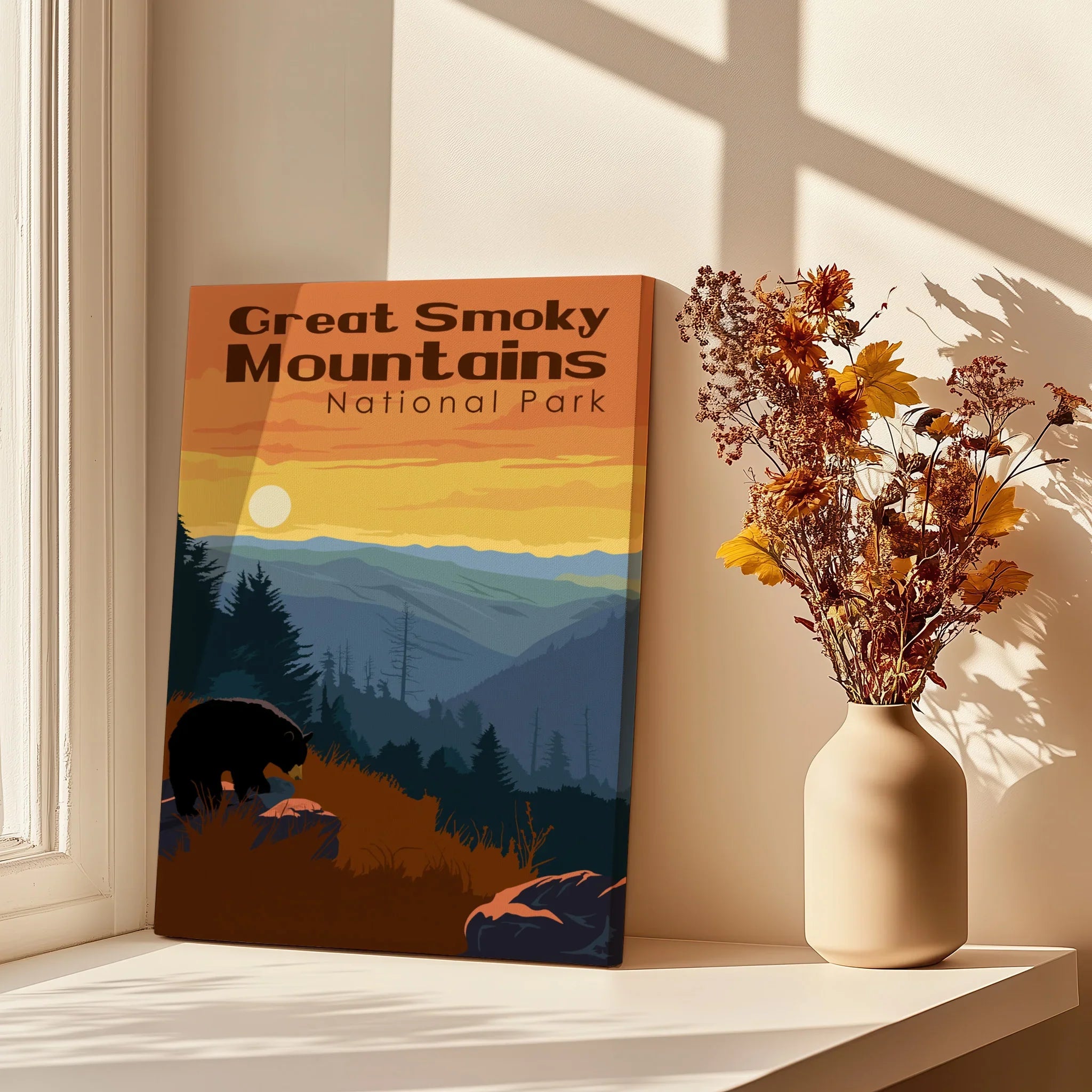 Great Smoky Mountains National Park print on canvas beside vase with dried flowers in sunlight