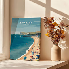 Swanage Dorset Wall Art Print | British Seaside Beach Travel Poster displayed by a window with a vase of flowers.
