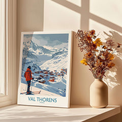 Val Thorens France Print showcasing a skier with a picturesque snowy landscape and charming village in Val Thorens, France.