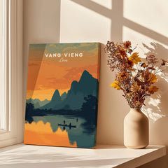 Vang Vieng Laos Travel Poster | Nam Song River Sunset Wall Art Print displayed in bright room with flowers.