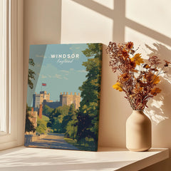 Windsor Castle travel poster canvas on windowsill with dried flowers in vase, sunlight and shadows