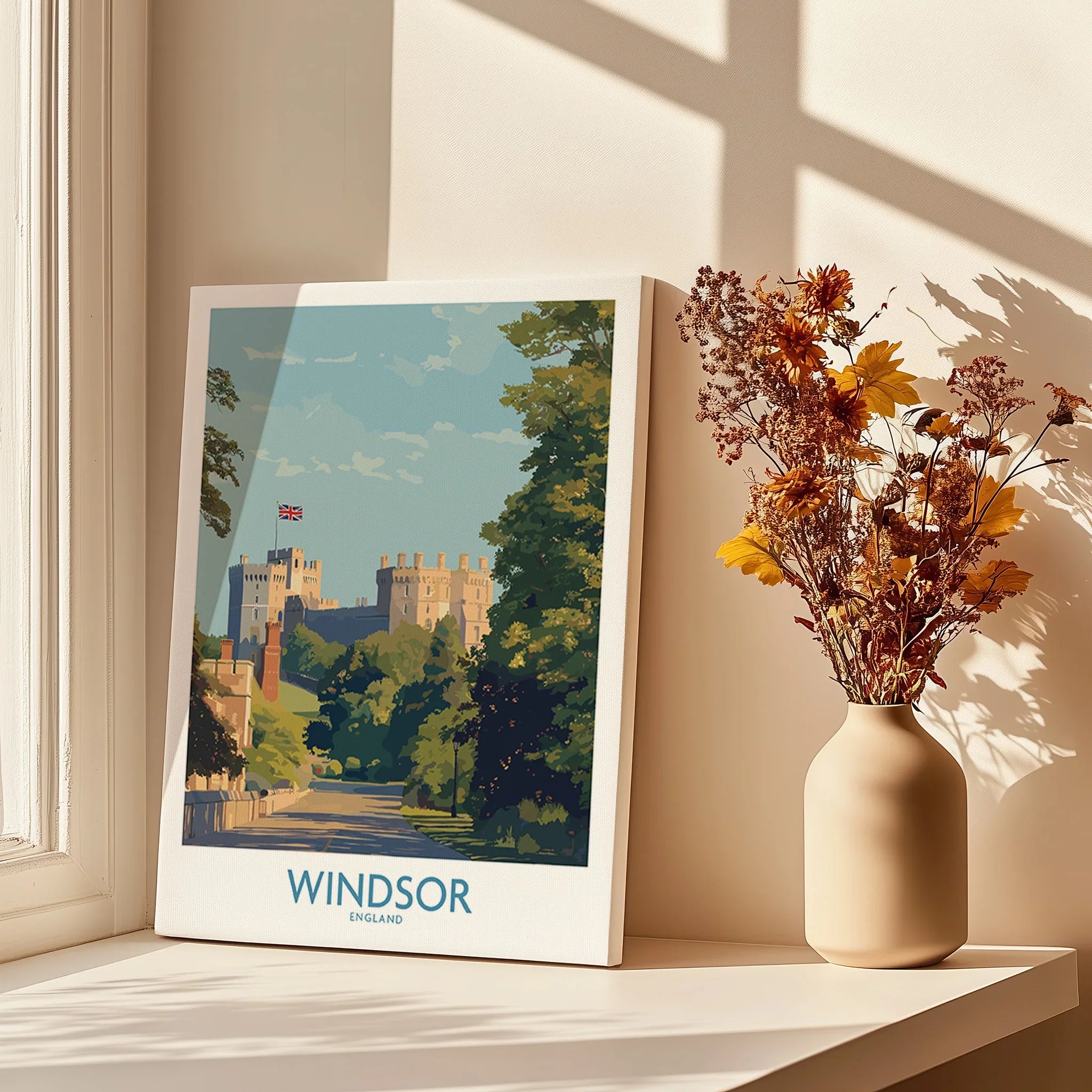 Windsor travel poster canvas print beside vase with dried flowers on sunlit windowsill.