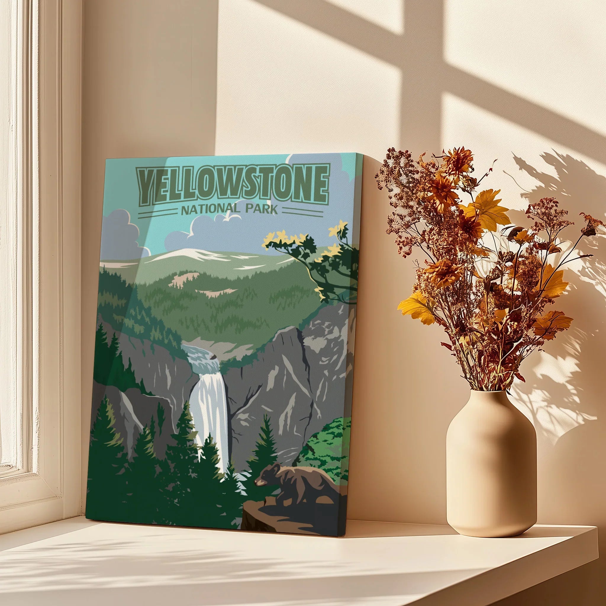 Yellowstone National Park canvas print with waterfall, next to vase of dried flowers on windowsill