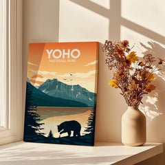 Yoho National Park wall art print with bear, mountains, and sunset by a vase of dried flowers