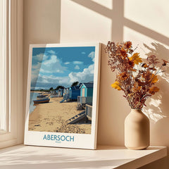 Abersoch Wales Beach Huts Art Print | Coastal Boats Wall Decor Poster showcasing colorful beach huts and boats on sandy shore.