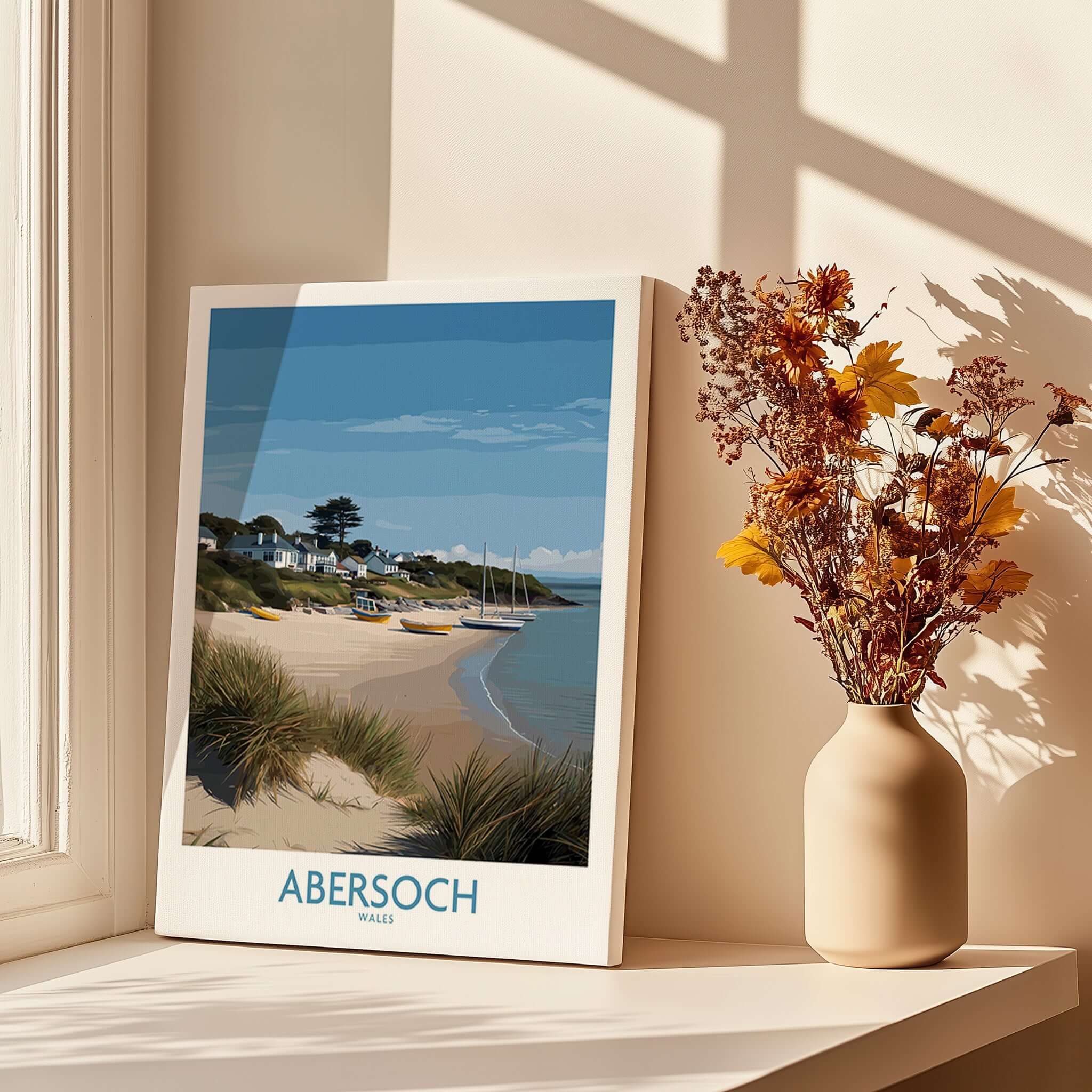 Abersoch Wales Sand Dunes Beach Art Print | Sailboats Coastal Wall Decor displayed in a sunlit room with dried flowers.