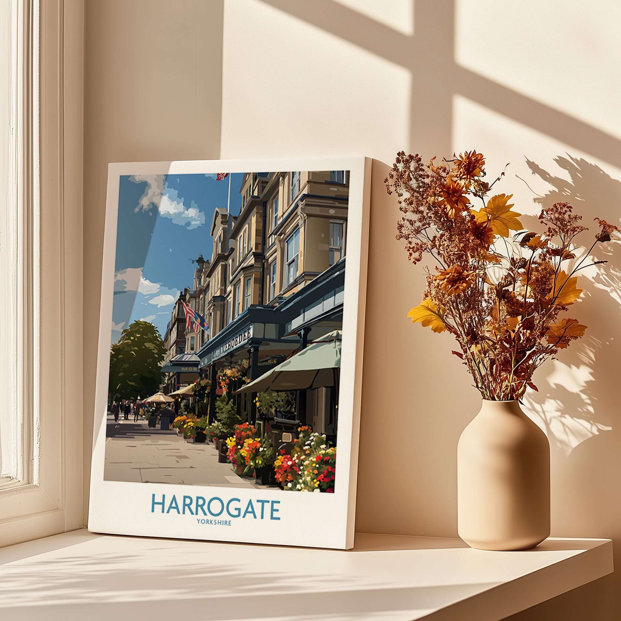Harrogate Yorkshire Art Print | Floral Cafe Scene Poster displayed beautifully with natural light and decorative flowers.