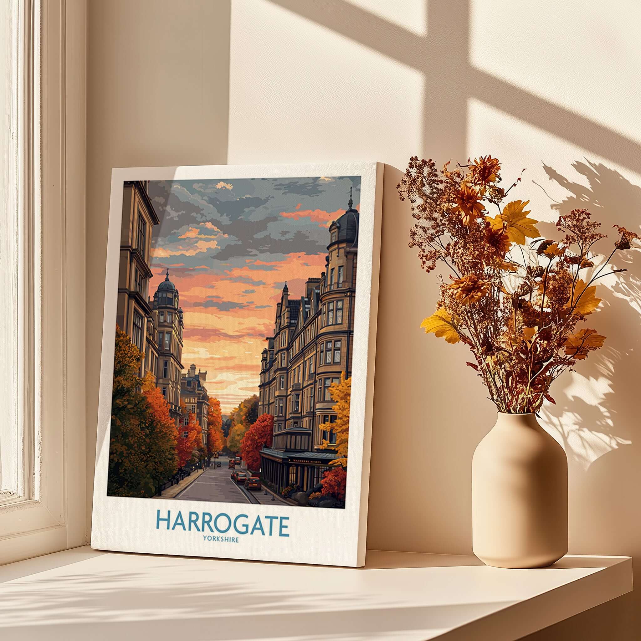 Harrogate Yorkshire Autumn Street Art Print | Sunset Avenue Poster displayed near flowers in a cozy interior.